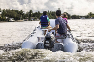 Suzuki 15 HP Black Tiller In Use on Dinghy Back View