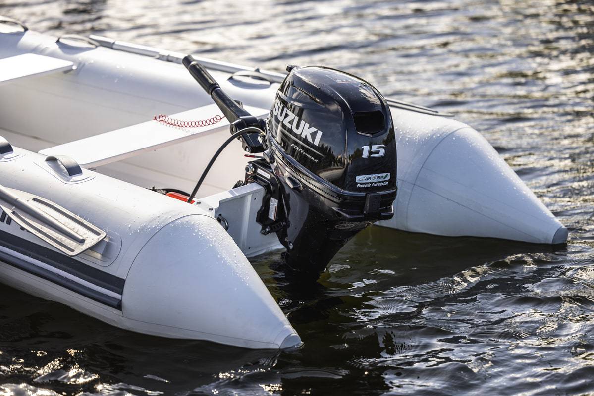 Suzuki 15 HP Black Tiller On Dinghy Diagonal