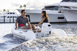 Suzuki 15 HP White Tiller In use On Dinghy Back View